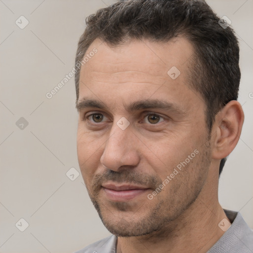 Joyful white adult male with short  brown hair and brown eyes