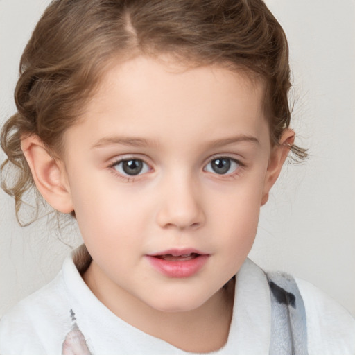 Joyful white child female with short  brown hair and brown eyes