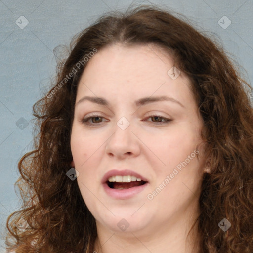 Joyful white adult female with long  brown hair and brown eyes