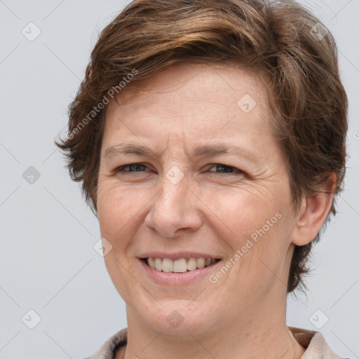 Joyful white adult female with short  brown hair and brown eyes