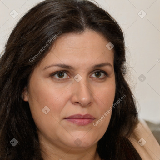 Joyful white adult female with long  brown hair and brown eyes