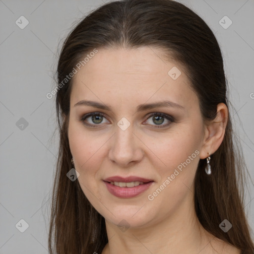 Joyful white young-adult female with long  brown hair and grey eyes