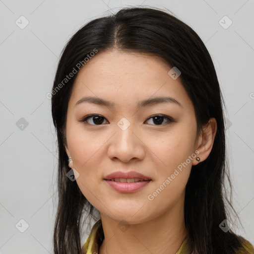 Joyful asian young-adult female with long  brown hair and brown eyes