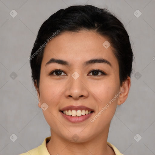 Joyful asian young-adult female with short  brown hair and brown eyes