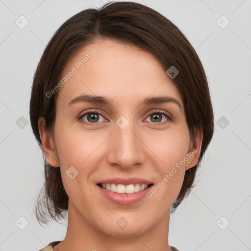 Joyful white young-adult female with medium  brown hair and green eyes