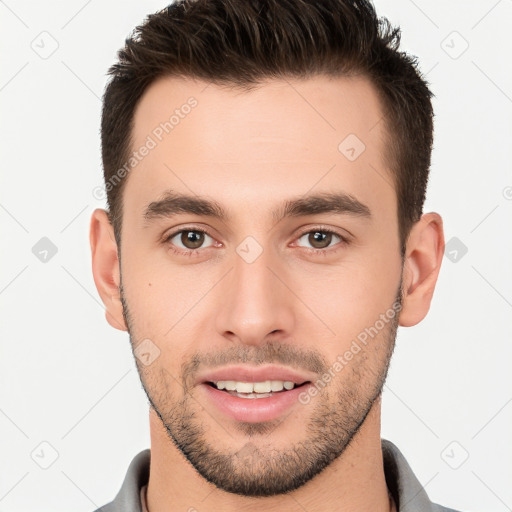 Joyful white young-adult male with short  brown hair and brown eyes