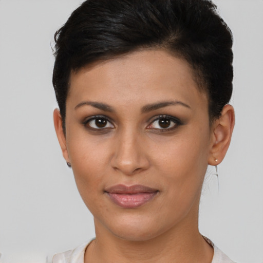 Joyful asian young-adult female with short  brown hair and brown eyes