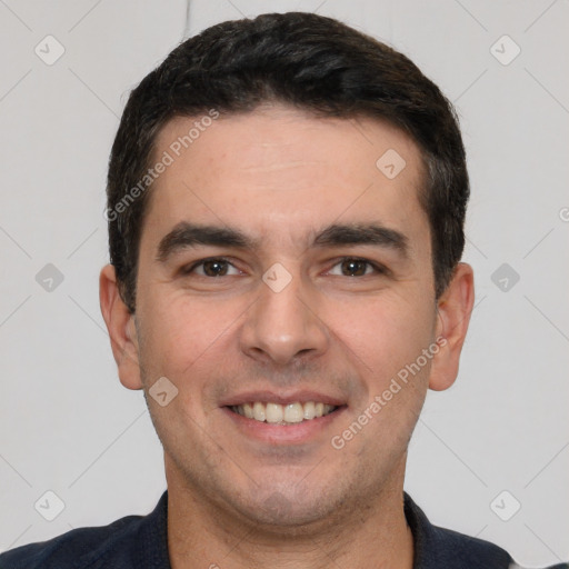 Joyful white young-adult male with short  black hair and brown eyes