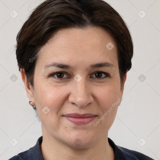 Joyful white adult female with short  brown hair and brown eyes