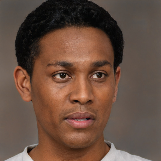 Neutral black young-adult male with short  black hair and brown eyes