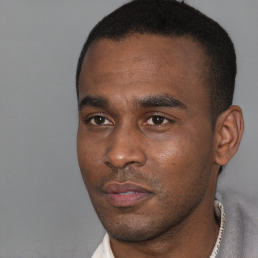 Neutral black young-adult male with short  black hair and brown eyes
