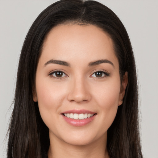 Joyful white young-adult female with long  brown hair and brown eyes