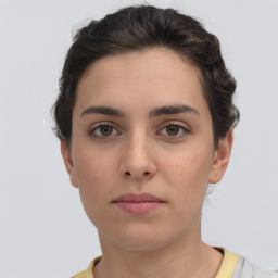 Neutral white young-adult female with short  brown hair and brown eyes