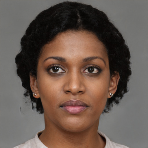 Neutral latino young-adult female with short  brown hair and brown eyes