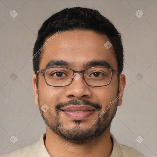 Joyful latino young-adult male with short  black hair and brown eyes