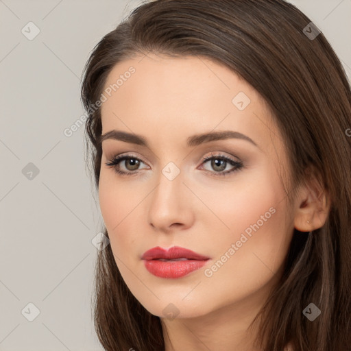 Neutral white young-adult female with long  brown hair and brown eyes