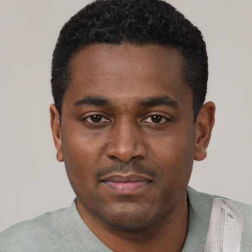 Neutral black young-adult male with short  black hair and brown eyes