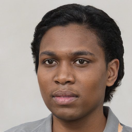 Neutral black young-adult male with short  black hair and brown eyes