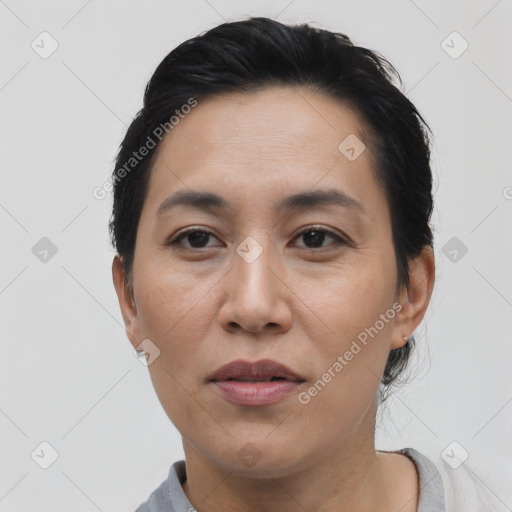 Joyful asian young-adult female with short  black hair and brown eyes