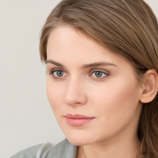 Neutral white young-adult female with long  brown hair and grey eyes