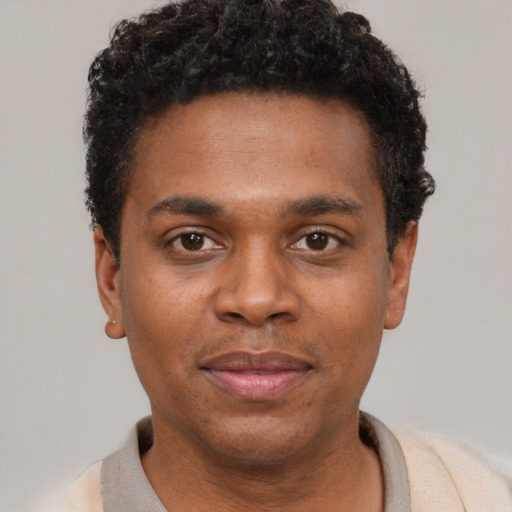Neutral black young-adult male with short  black hair and brown eyes