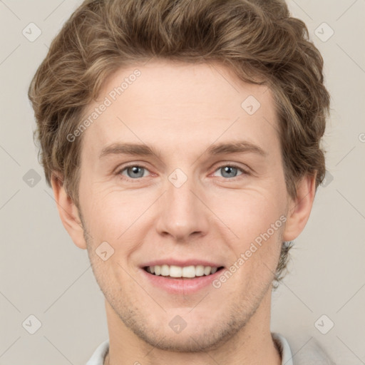 Joyful white adult male with short  brown hair and grey eyes