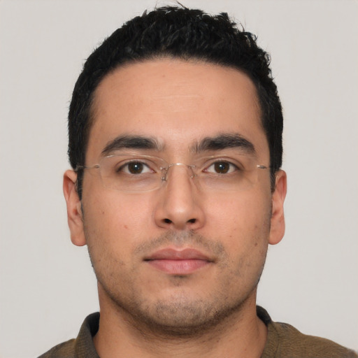 Neutral latino young-adult male with short  black hair and brown eyes