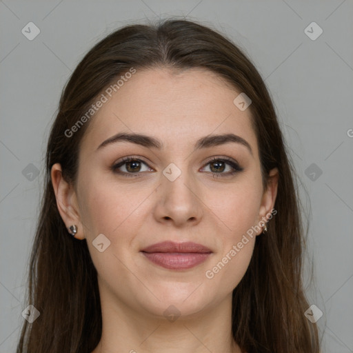 Joyful white young-adult female with long  brown hair and grey eyes