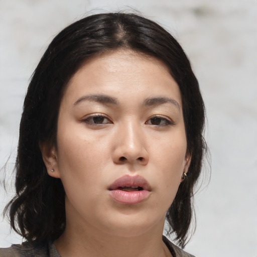 Neutral asian young-adult female with medium  brown hair and brown eyes