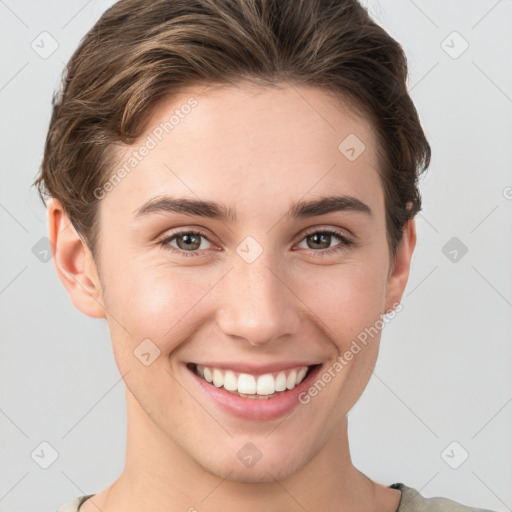 Joyful white young-adult female with short  brown hair and grey eyes