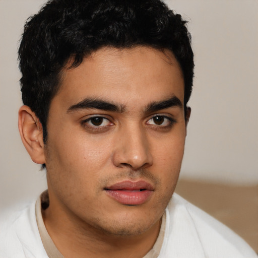 Neutral latino young-adult male with short  brown hair and brown eyes