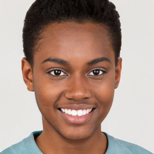 Joyful black young-adult female with short  brown hair and brown eyes