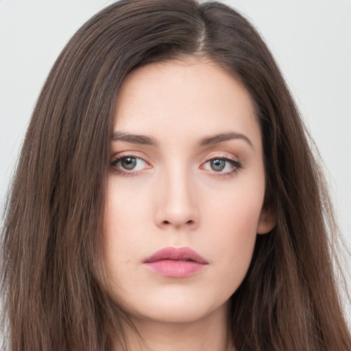 Neutral white young-adult female with long  brown hair and brown eyes