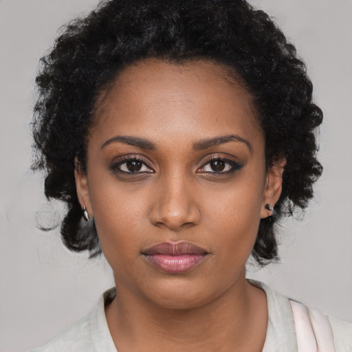 Neutral black young-adult female with medium  black hair and brown eyes