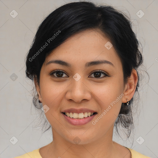 Joyful asian young-adult female with medium  black hair and brown eyes