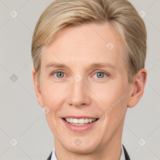 Joyful white adult female with short  brown hair and grey eyes