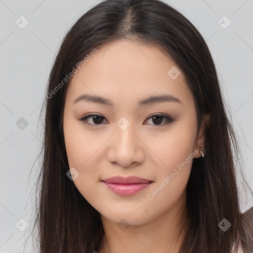 Joyful asian young-adult female with long  brown hair and brown eyes