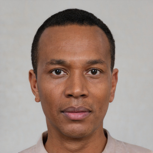 Neutral black young-adult male with short  black hair and brown eyes