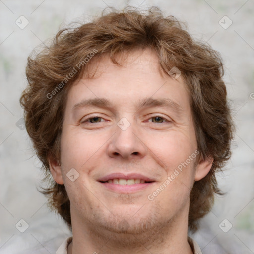 Joyful white adult male with medium  brown hair and brown eyes