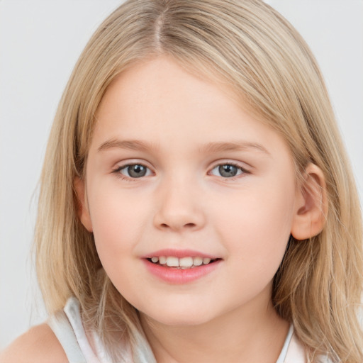 Joyful white child female with medium  brown hair and grey eyes