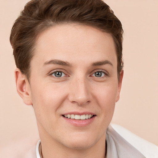 Joyful white young-adult female with short  brown hair and grey eyes