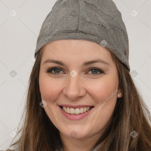 Joyful white young-adult female with long  brown hair and grey eyes