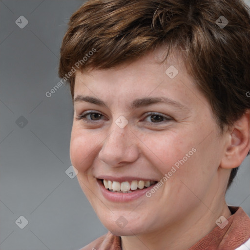 Joyful white young-adult female with short  brown hair and brown eyes