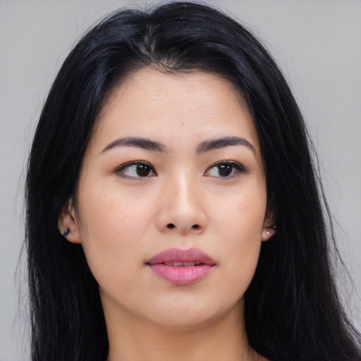 Joyful asian young-adult female with long  black hair and brown eyes