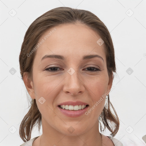 Joyful white adult female with medium  brown hair and brown eyes