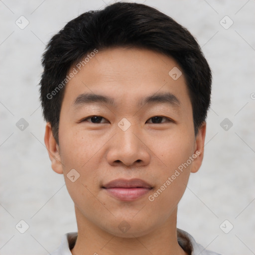 Joyful asian young-adult male with short  black hair and brown eyes