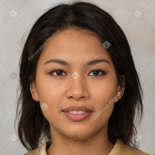 Joyful latino young-adult female with medium  brown hair and brown eyes