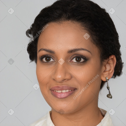 Joyful black young-adult female with medium  brown hair and brown eyes