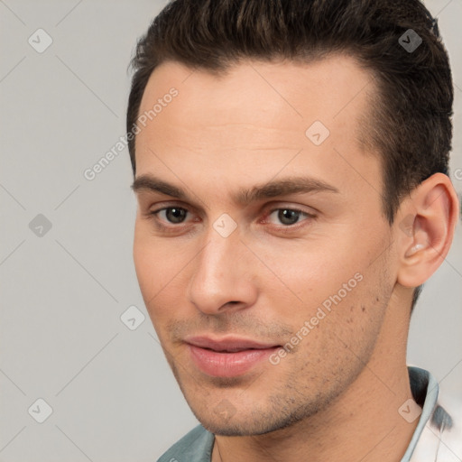 Joyful white young-adult male with short  brown hair and brown eyes