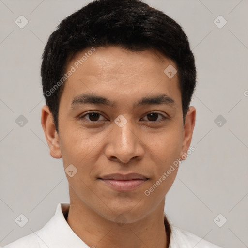 Joyful latino young-adult male with short  brown hair and brown eyes